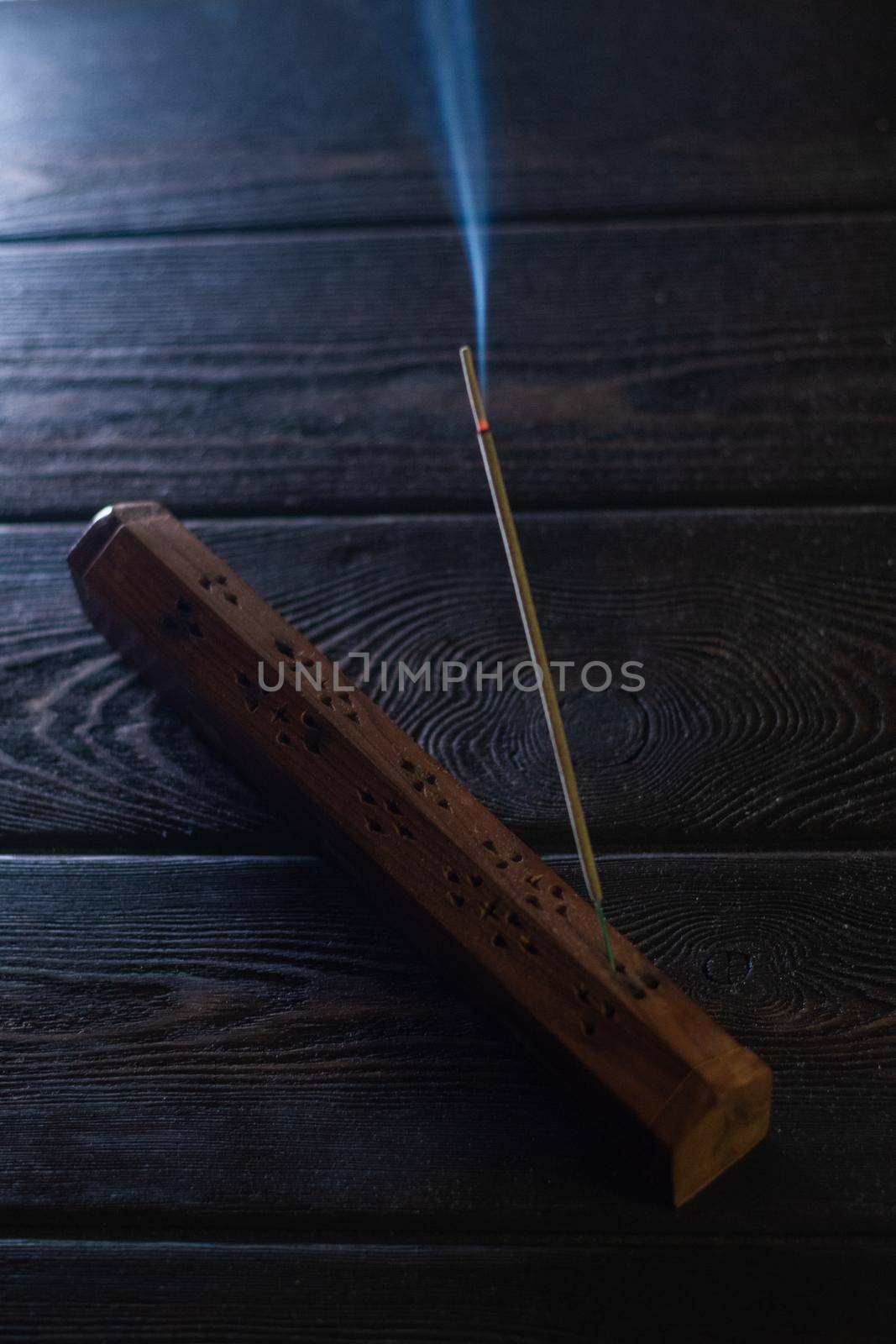 Focus on incense stick and smoke. by snep_photo