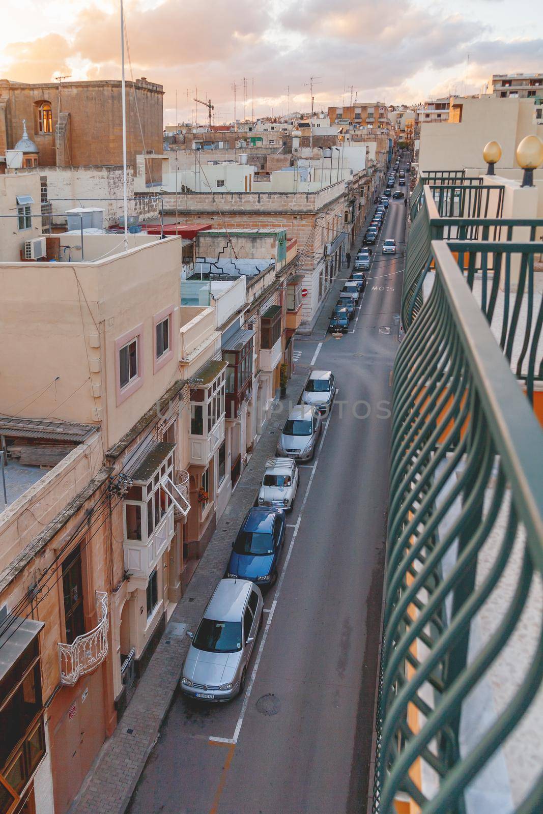 SLIEMA, MALTA - February 12, 2010. Cars are parked along the street. View on town from third floor of building. by aksenovko