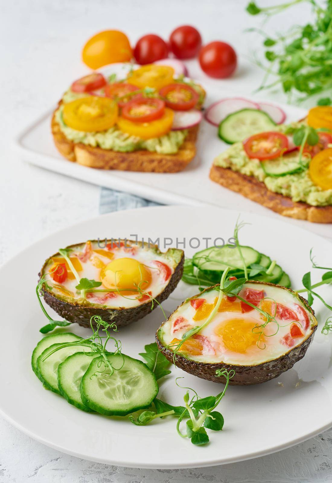 egg baked in avocado, toast, breakfast, closeup by NataBene