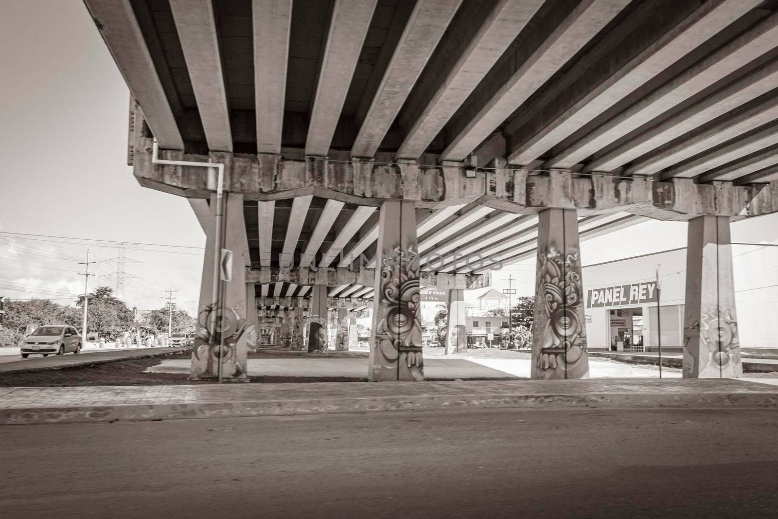 Playa del Carmen Mexico 04. February 2022 Old black and white picture of typical Highway Freeway bridge and street road and cityscape with cars buildings of Playa del Carmen in Mexico.