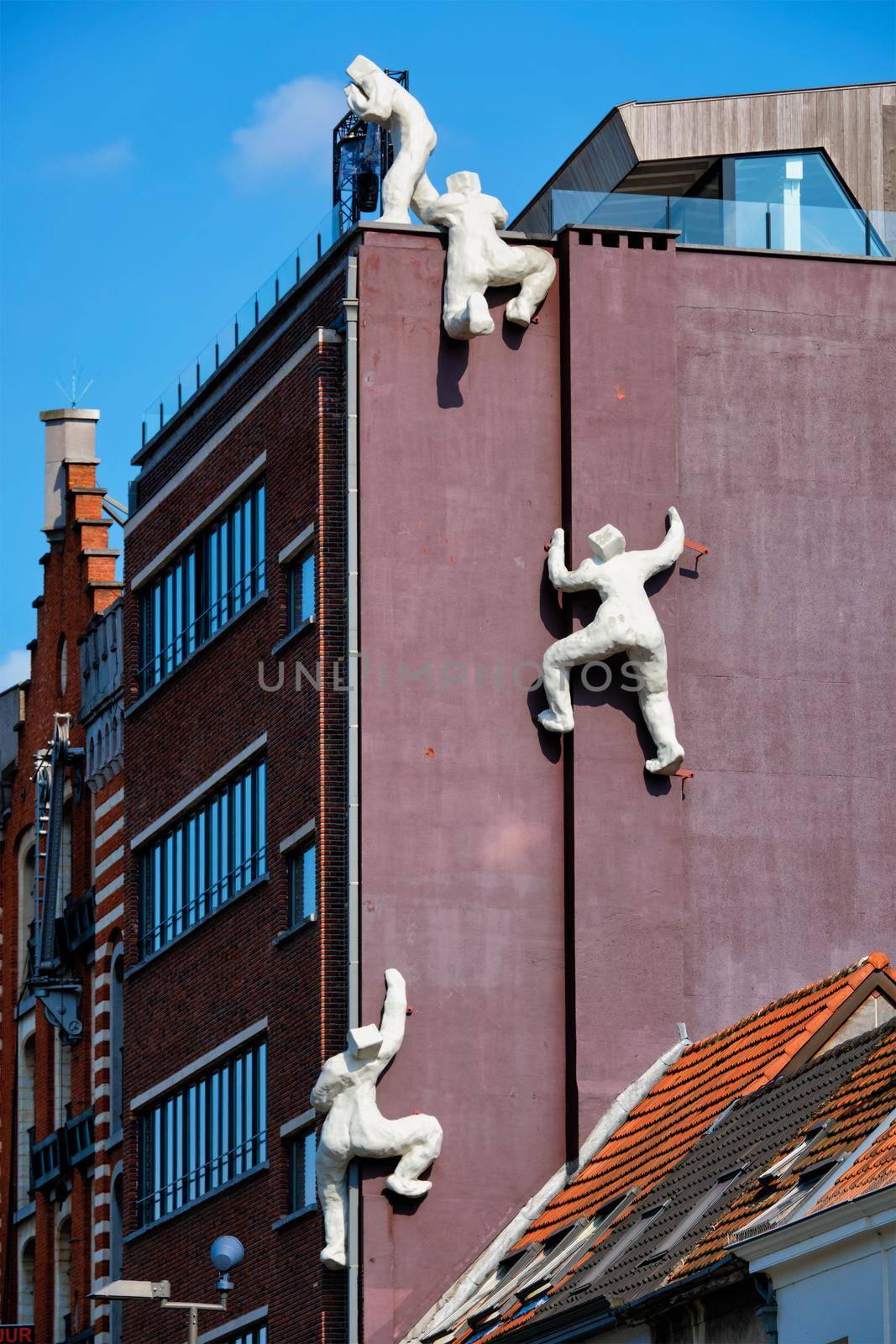 ANTWERP, BELGIUM - MAY 26, 2018: De fluisteraar (The whisperer) statue in Antwerp, Belgium