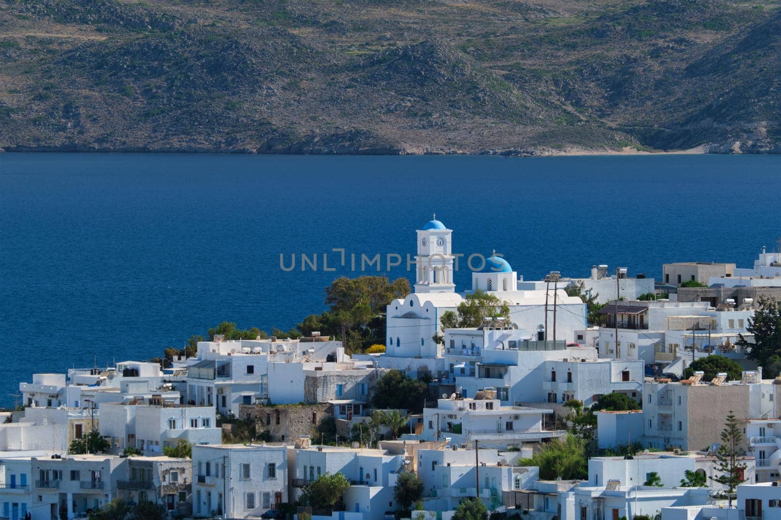 View of Plaka village with traditional Greek church. Milos island, Greece by dimol