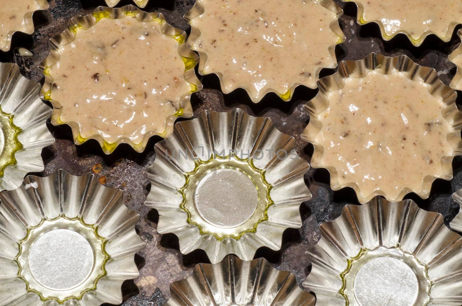 Aluminum molds for baking cupcakes. From the series "Cooking pumpkin cupcakes"