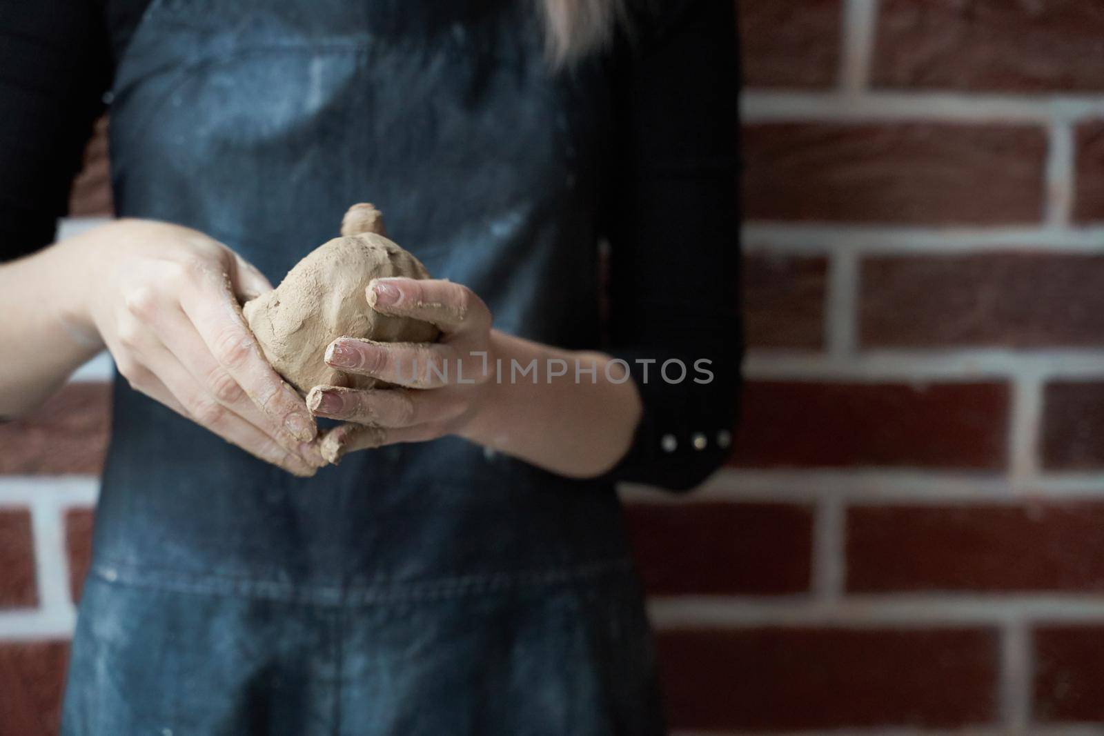 Unrecognisable woman making ceramic bowl in hand. Creative hobby concept. Earn extra money, side hustle, turning hobbies into cash, passion into a job, copy empty space