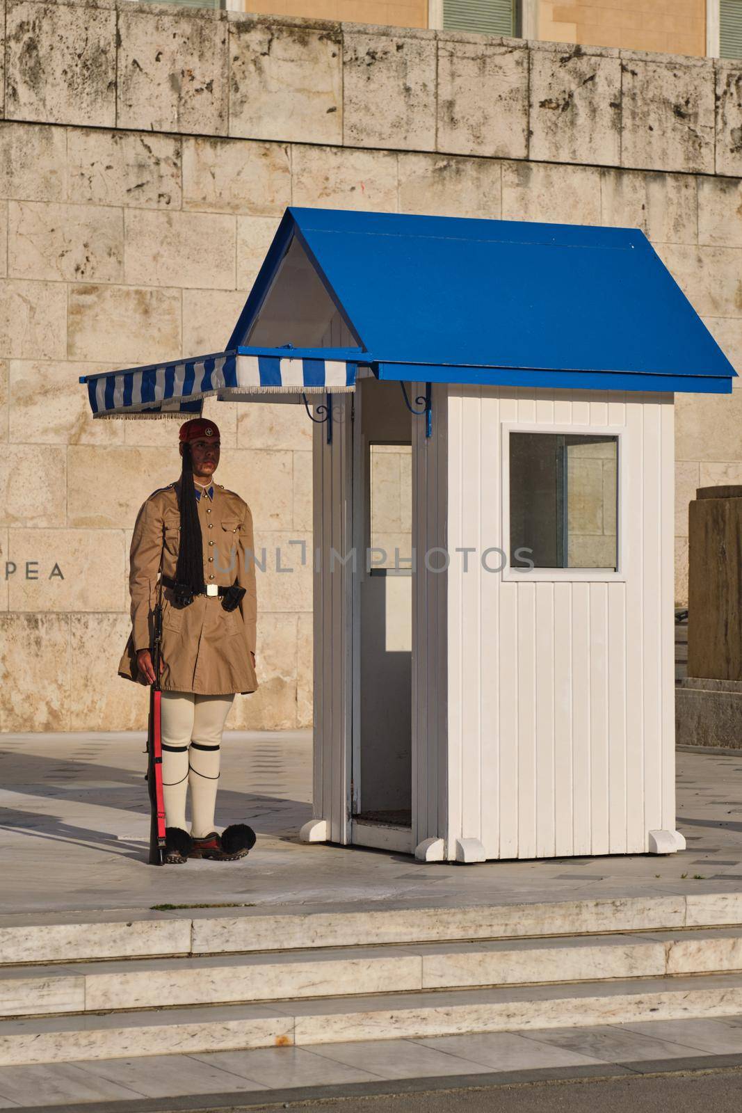 ATHENS, GREECE - MAY 20, 2010: Presidential ceremonial guard Evzone in front of the Monument of the Unknown Soldier near Greek Parliament, Syntagma square, Athenes, Greece