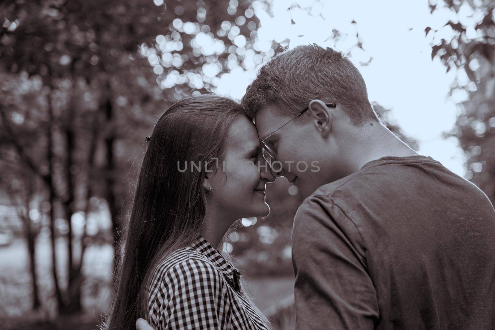 Teenagers are looking at each other closeup, black-and-white concept of love by NataBene