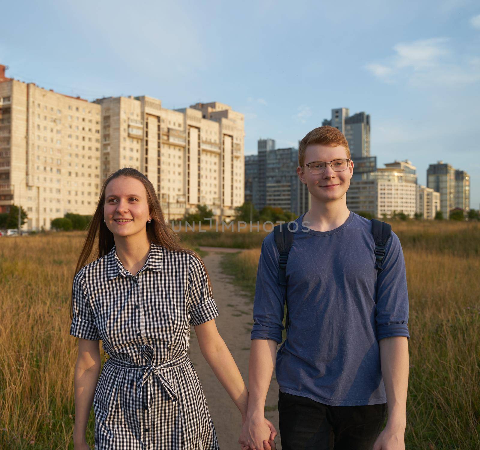 girlfriend and boyfriend together, holding hands, smiling, teen relationships