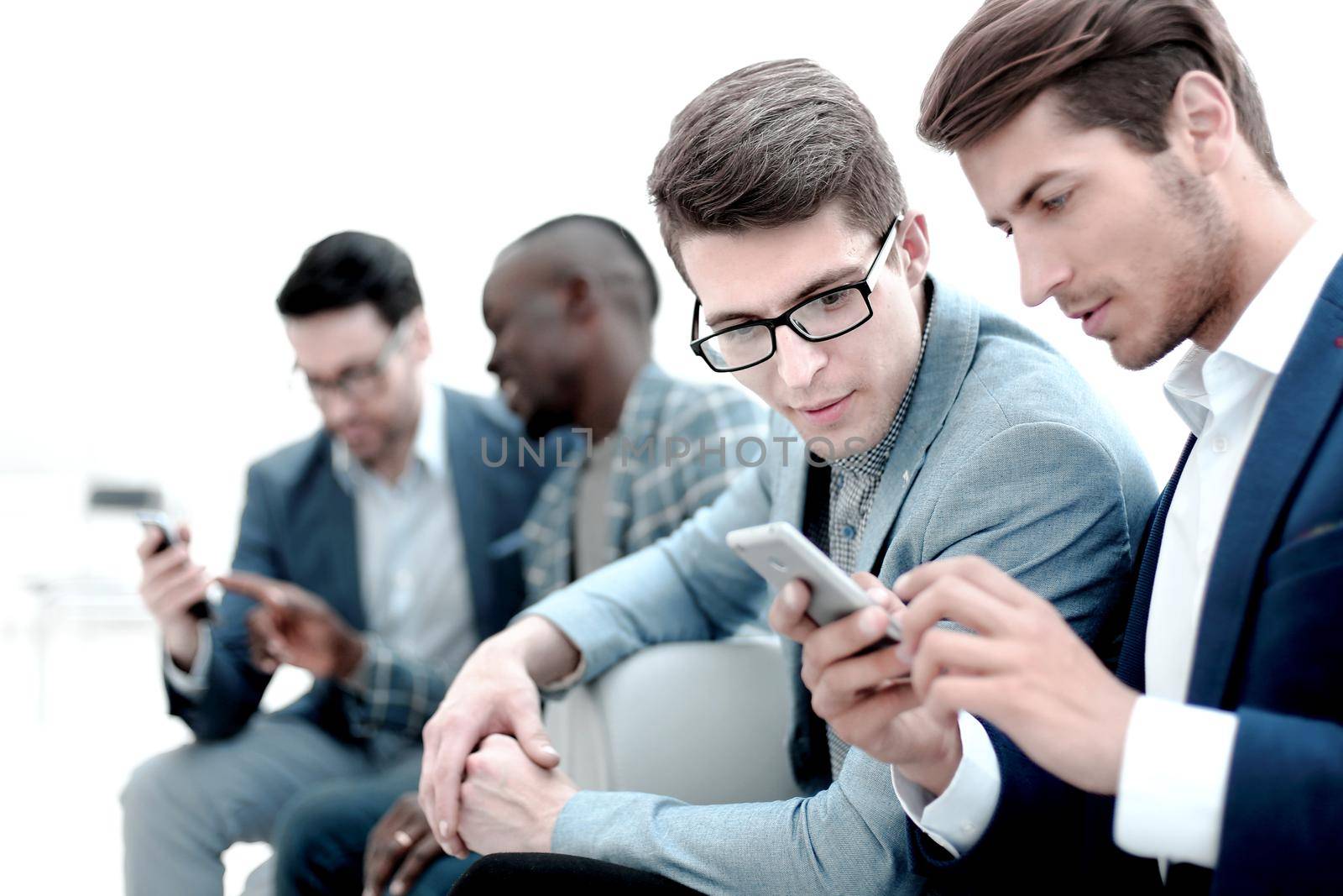 business colleagues reading SMS on smartphone by asdf