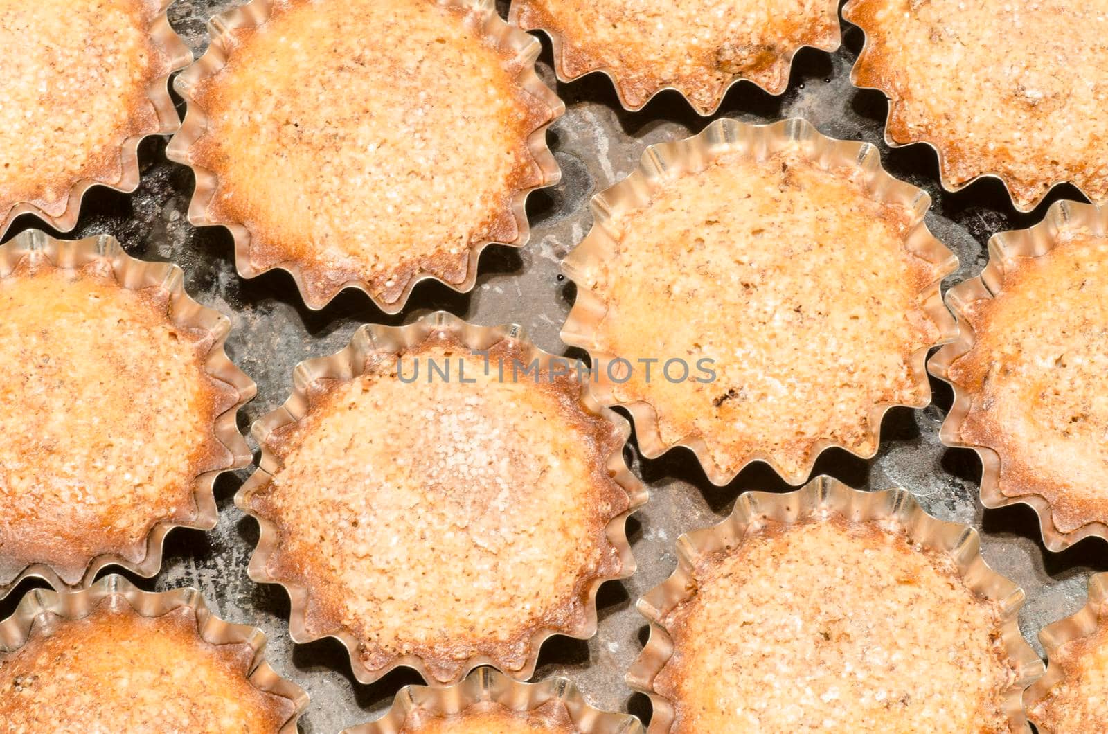 Ready pumpkin muffins in a baking dish. From the series "Cooking pumpkin cupcakes"