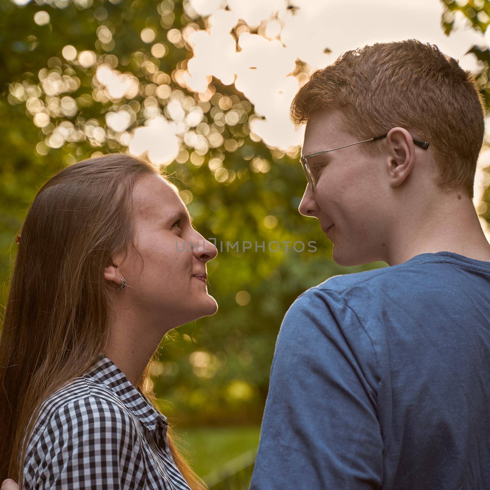 male and female person looking at each other, flirting, concept of teen love and happiness