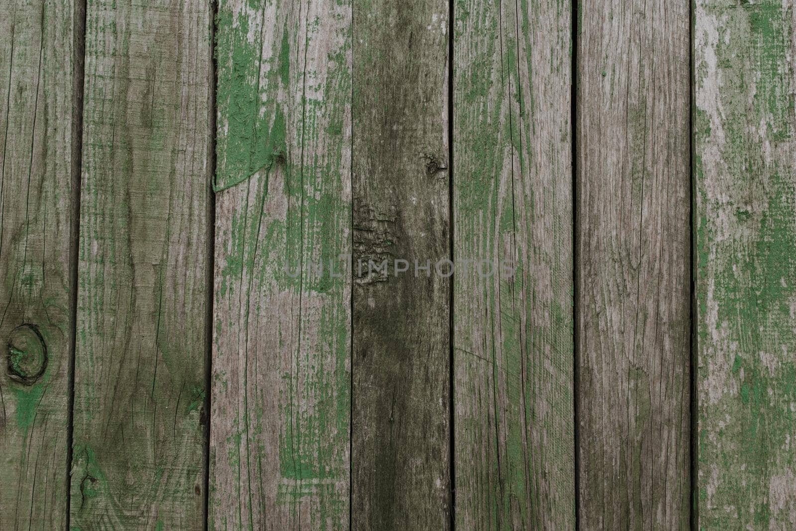 old shabby gray fence made of wooden boards by AndriiDrachuk