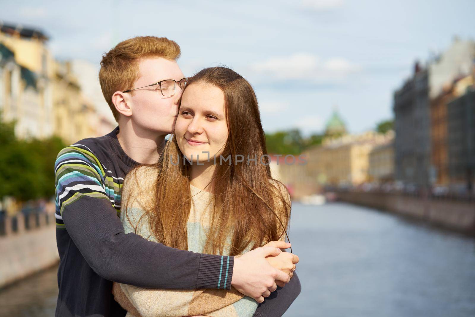 red-haired man kisses a woman on her hear, a boy in a sweater comforts a girl with long dark thick hair by NataBene
