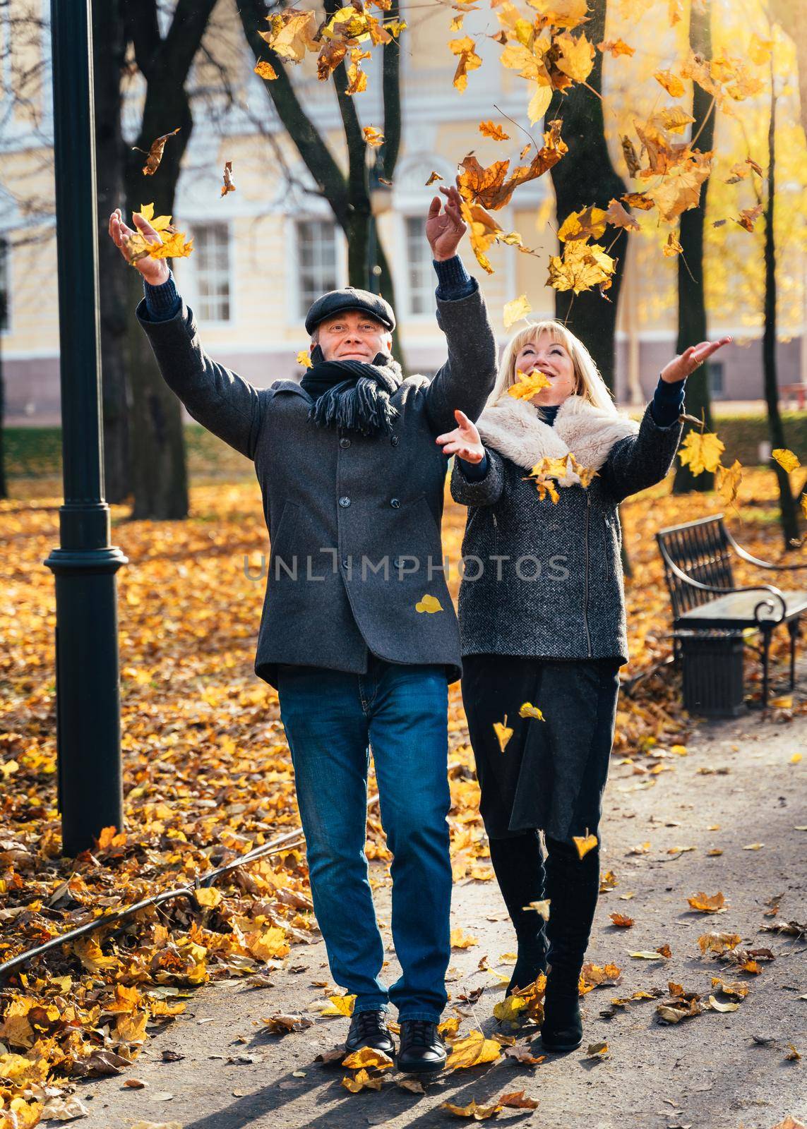 Happy blonde mature woman and handsome middle-aged brunette man by NataBene