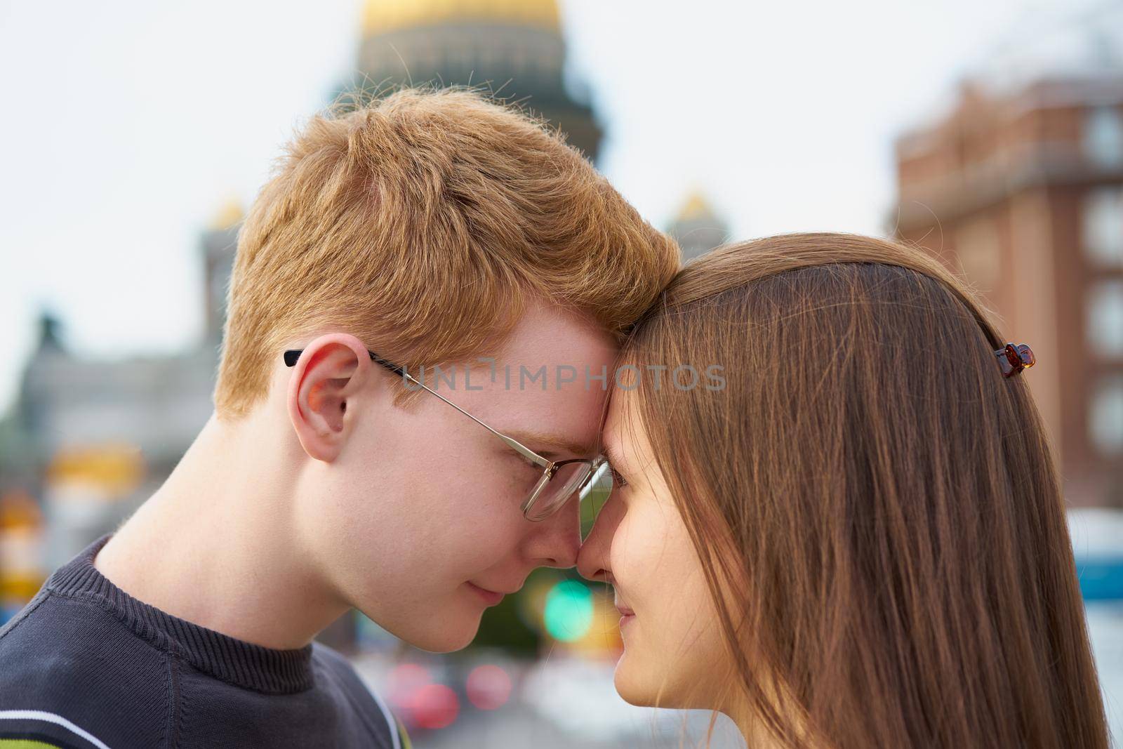 male and female person looking at each other, young couple full of love, close up
