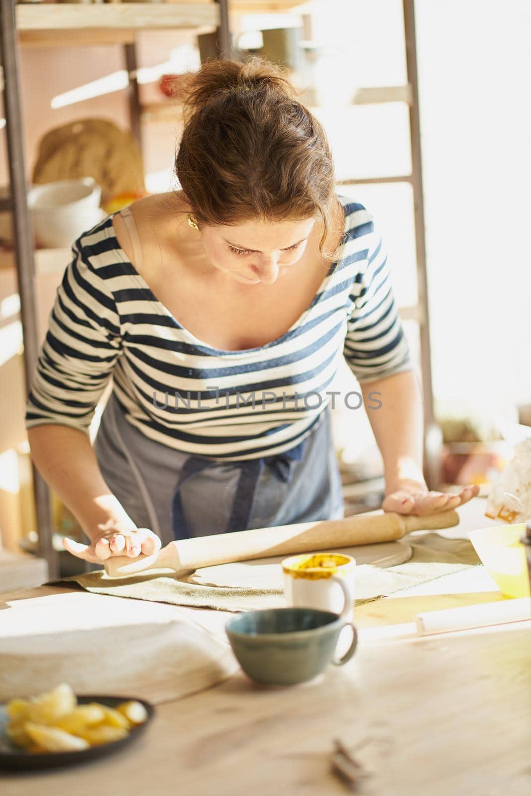 Woman freelance, business, hobby. Woman making ceramic pottery by NataBene