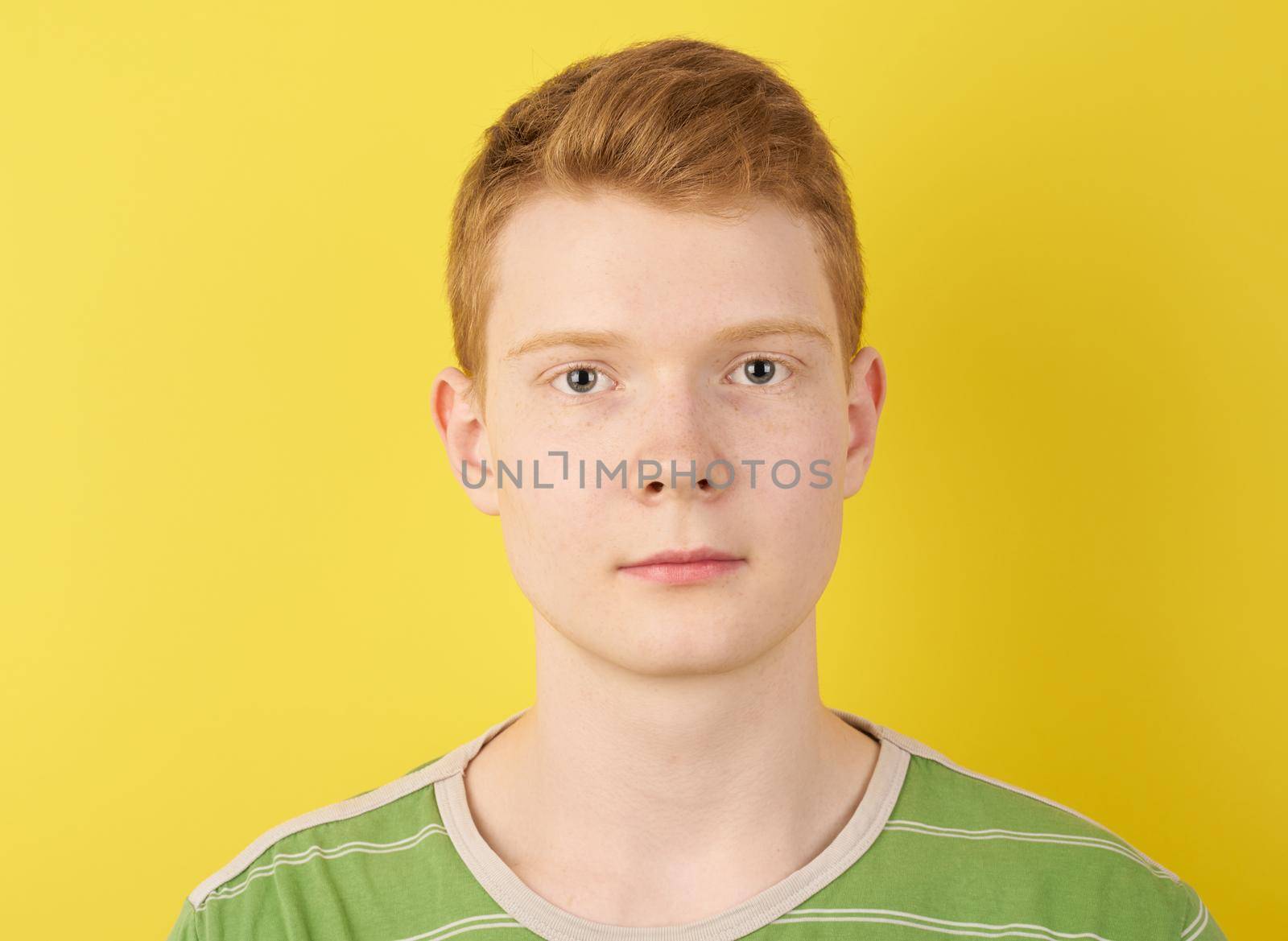 Irish redhead teenager on yellow background closeup by NataBene