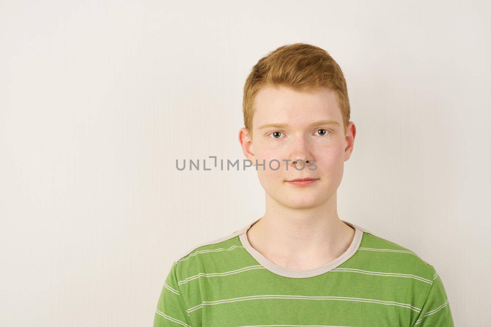 shaven irish teenager looking in camera, copy space