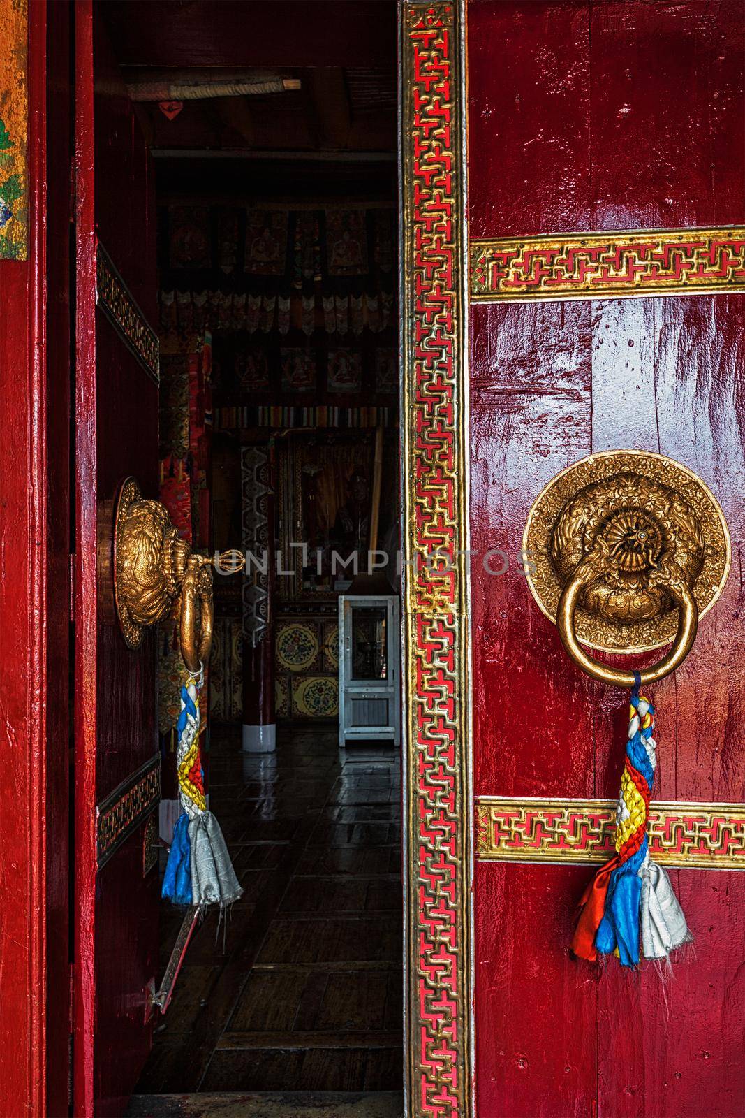 Open leaf of gate of Spituk Gompa (Tibetan Buddhist monastery) with ornamented decorated door handle. Ladakh, India