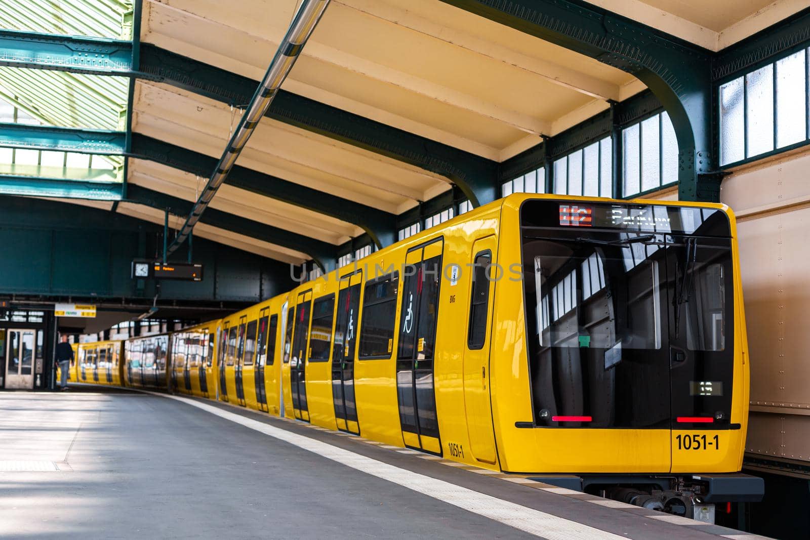 Modern subway. Yellow train at the station.