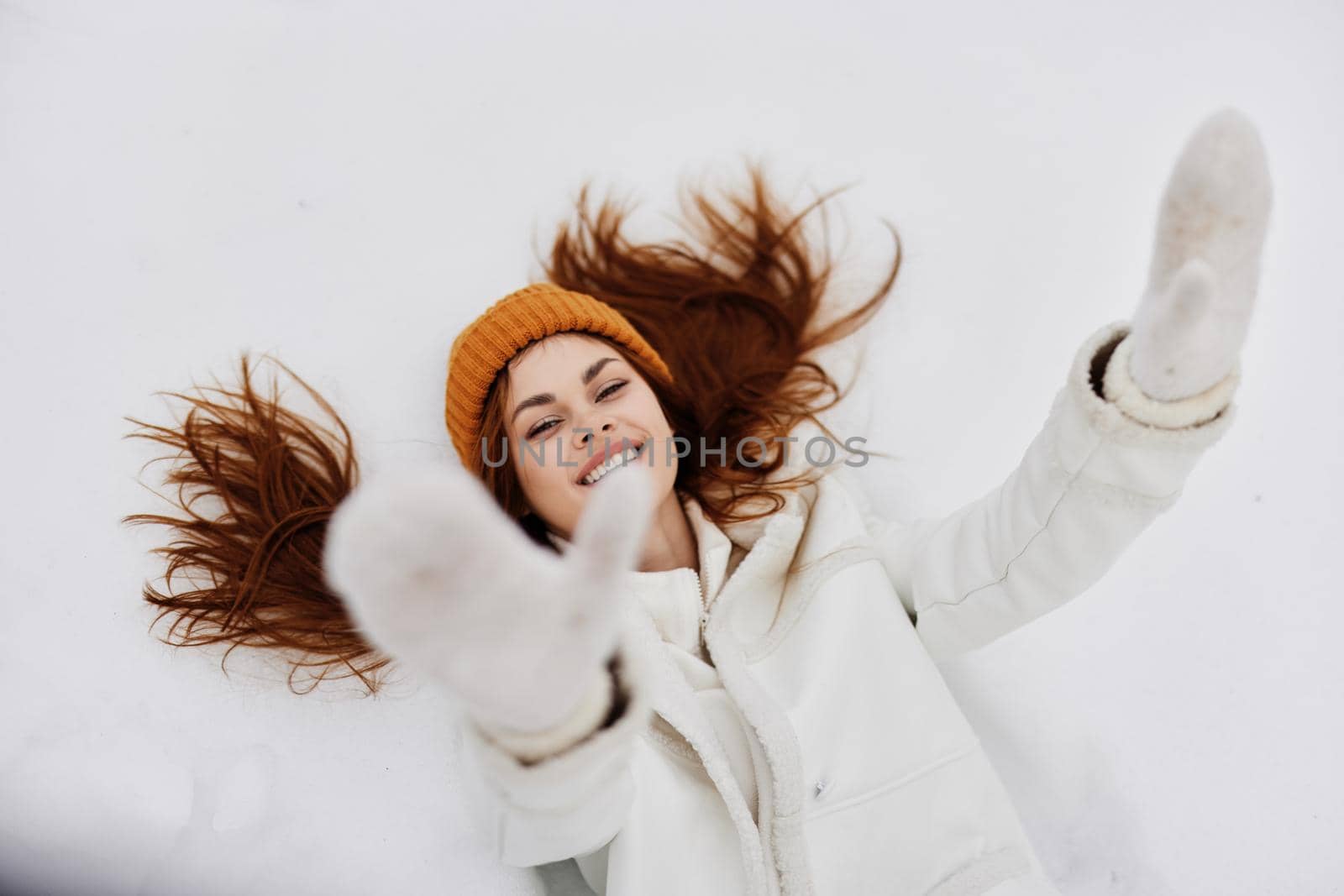 woman lies on the snow fun rest nature There is a lot of snow around by SHOTPRIME