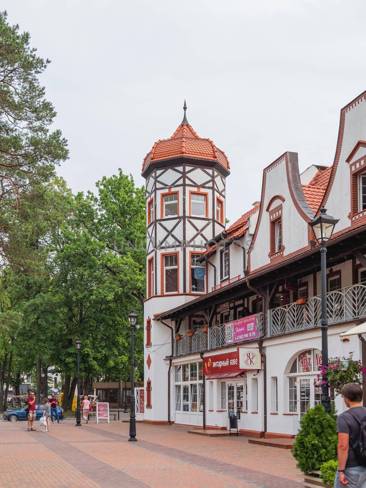 SVETLOGORSK, RUSSIA - July 21, 2019. Local people and tourists walk on Central square of Svetlogorsk, ex-Rauschen. by aksenovko