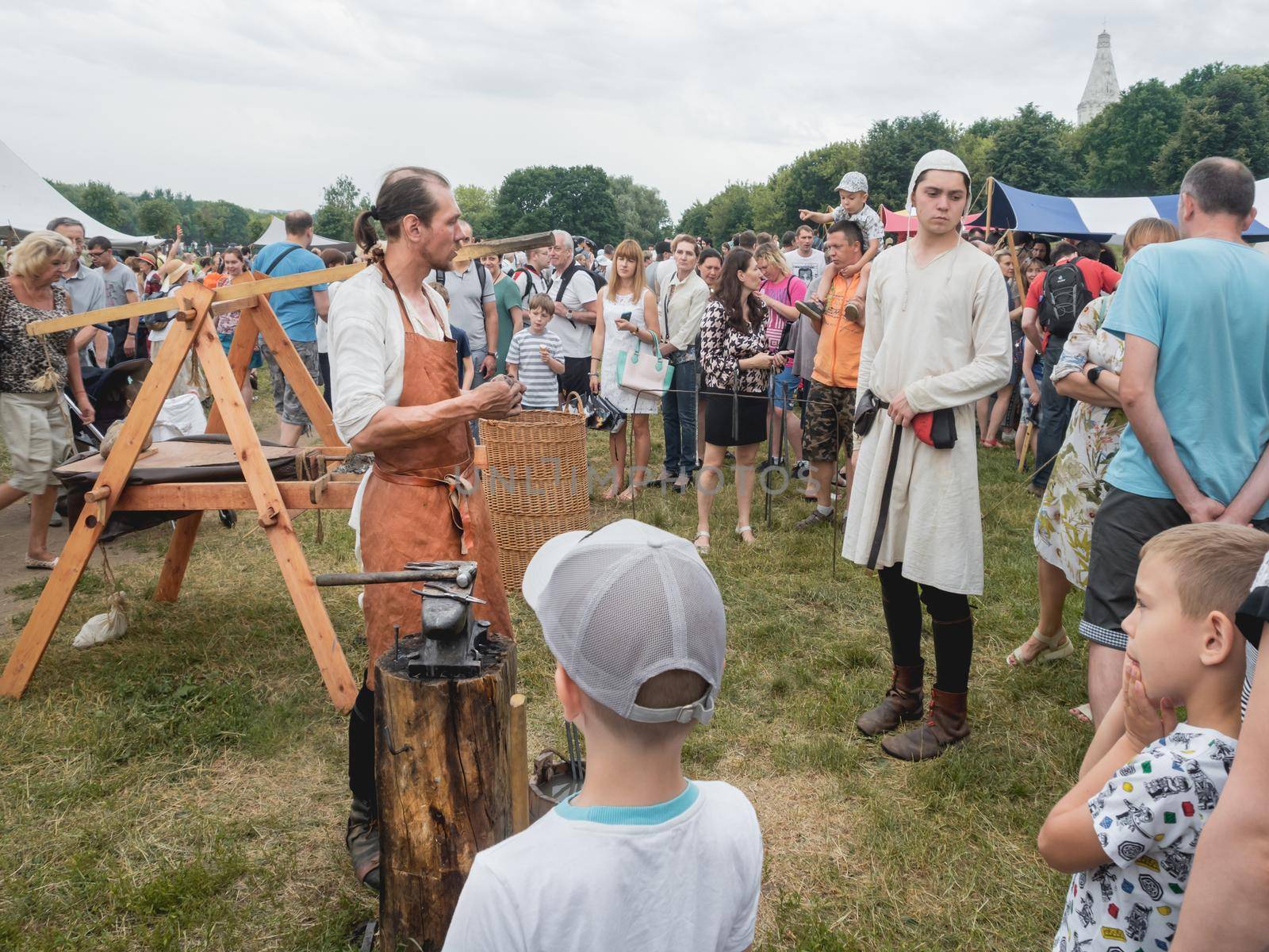 MOSCOW, RUSSIA - June 12, 2019. Local people and tourists on annual festival Times and Epochs. Historical reconstruction. by aksenovko