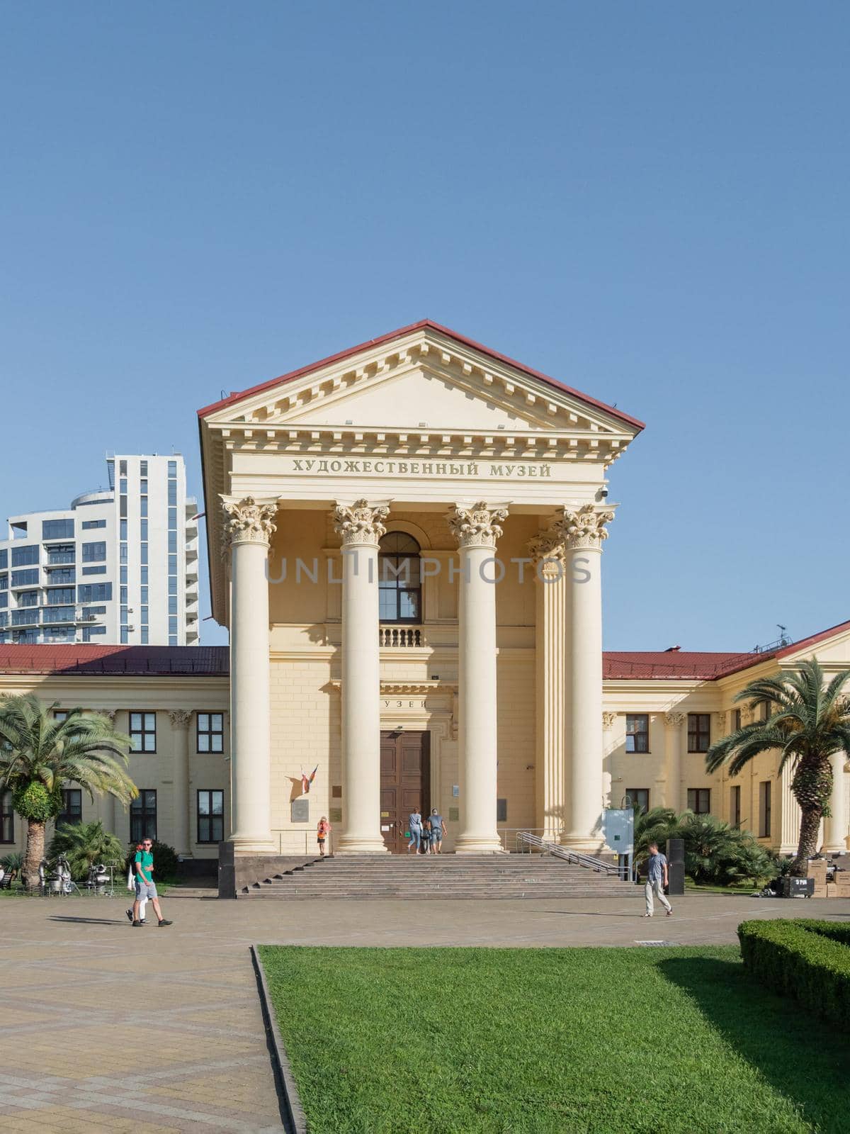 SOCHI, RUSSIA - May 27, 2021. People walk pass main entrance of Sochi Art Museum of Dmitry Zhilinsky.