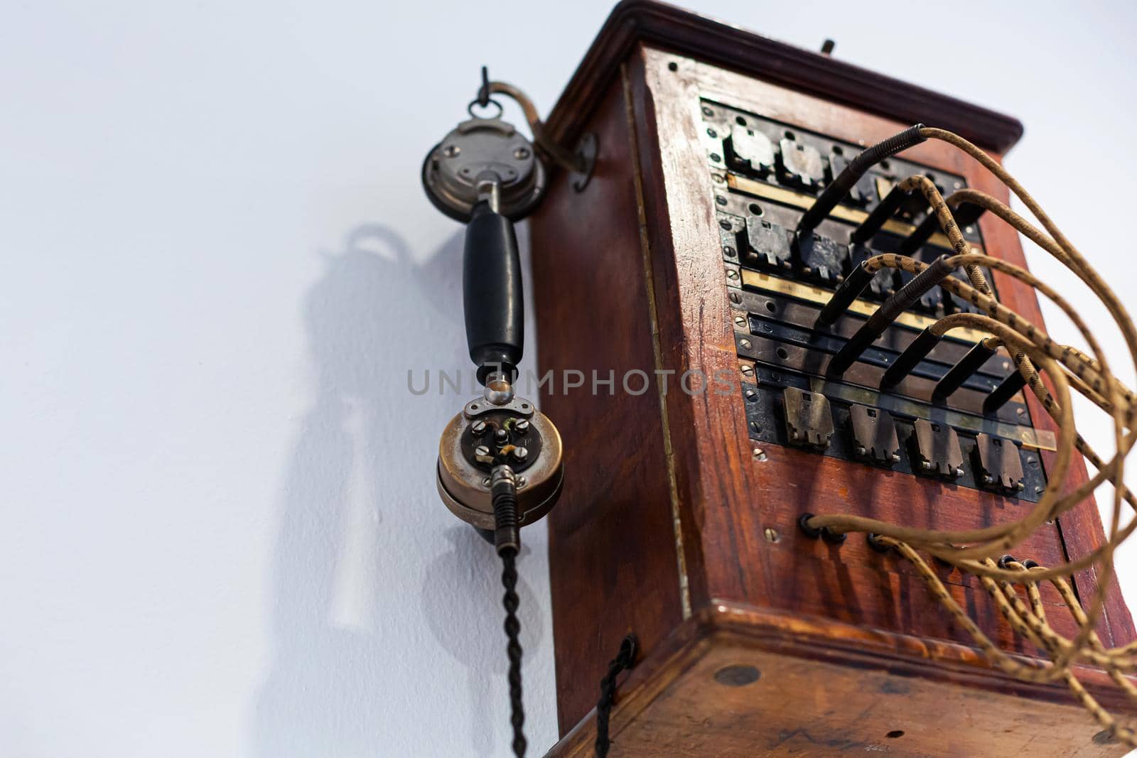 Details of the antique telephone set made of wood.