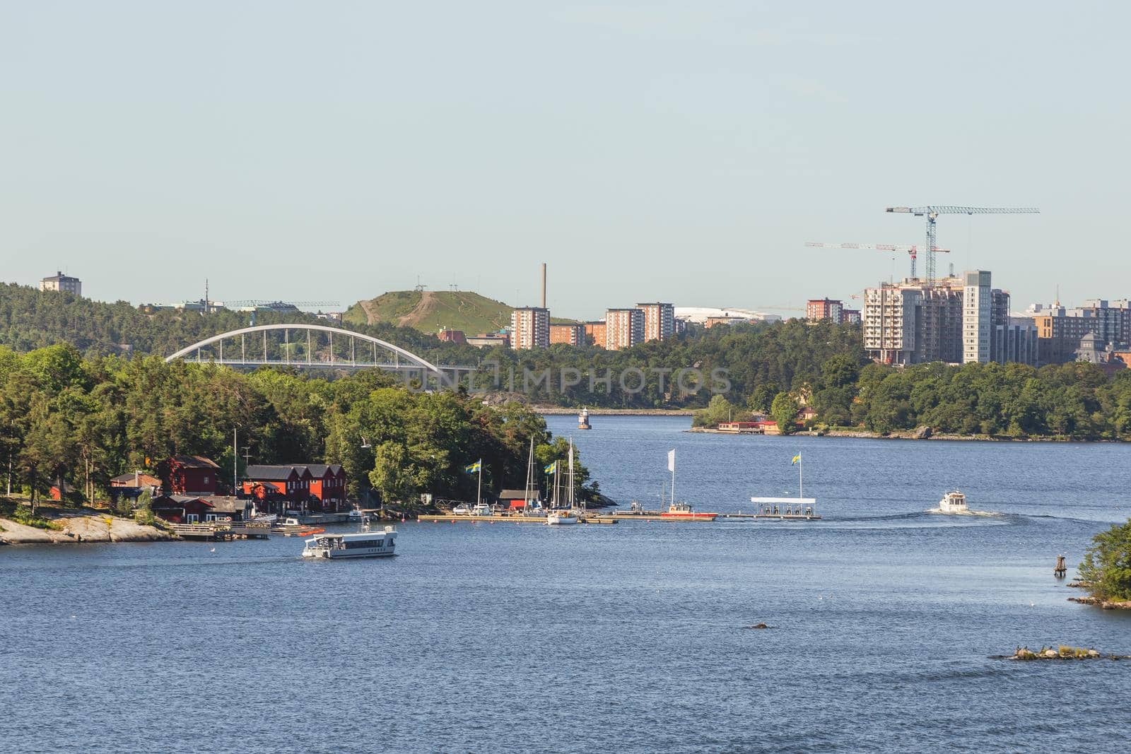 View from ship to suburbs of Stockholm. Ferry trip across Baltic Sea. Tourism to Europe and Scandinavia. Sweden.