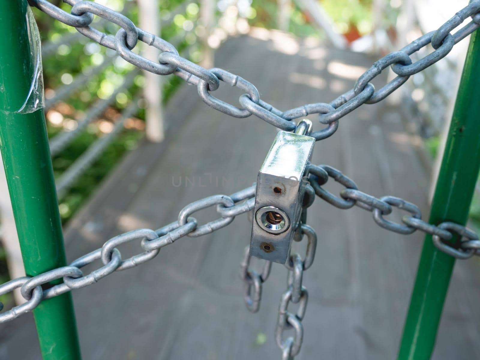 Way forward is locked with metal chain and locker. Forbidden territory.