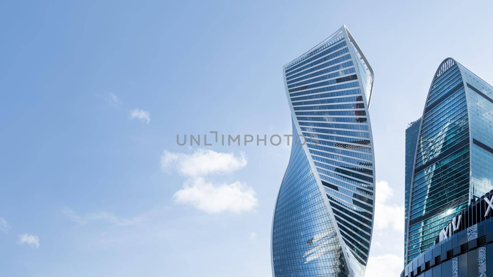 MOSCOW, RUSSIA - September 18, 2021. Evolution tower of Moscow International Business Center MIBC on clear blue sky background. Banner with copy space.