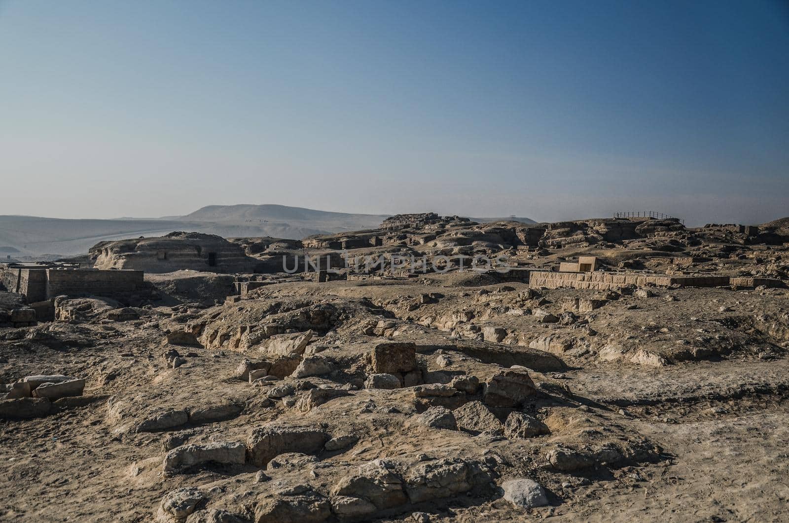 Ancient Egyptian Ruins and PyramidsThe sandy desert in Cairo by AndriiDrachuk