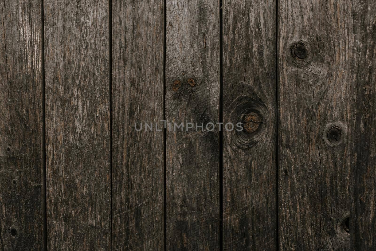 old shabby gray fence made of wooden boards by AndriiDrachuk