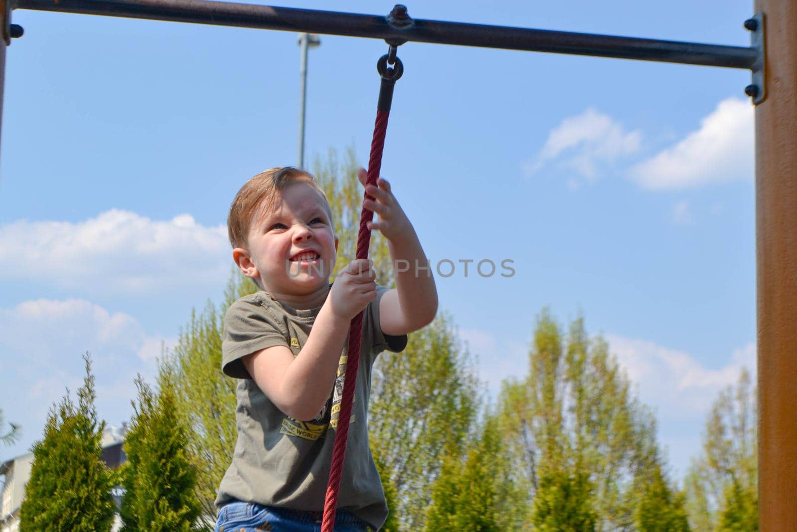 Modern children playground in park. Made in different colors. High quality photo.