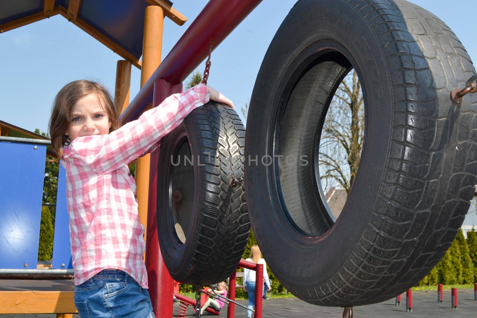 Modern children playground in park. Made in different colors. High quality photo.