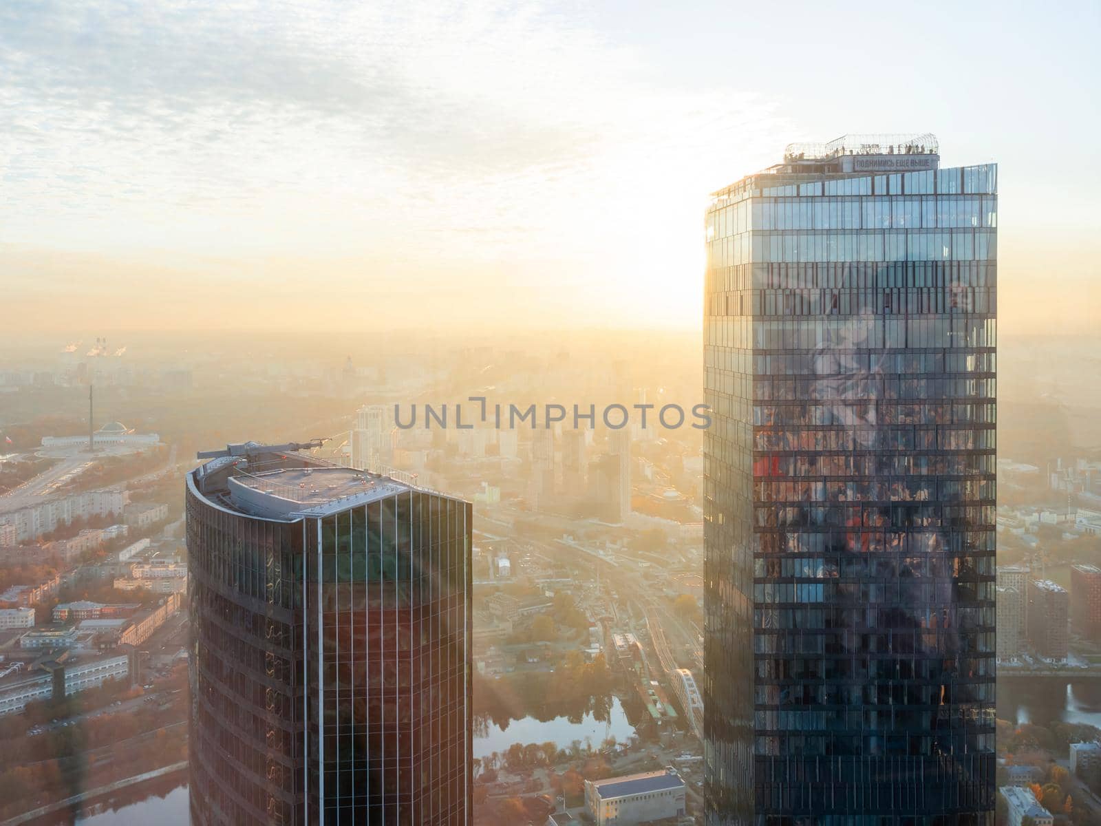 MOSCOW, RUSSIA - October 07, 2021. Panorama view from skyscraper of Moscow-city business center at sunset. by aksenovko
