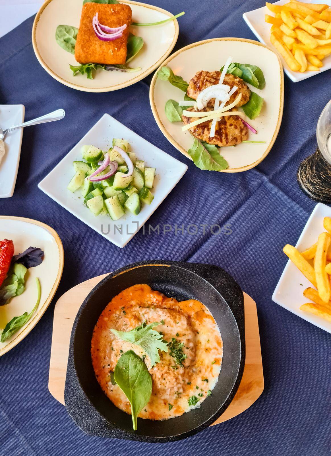 Many bowls with food on a table - Greek buffet in a restaurant