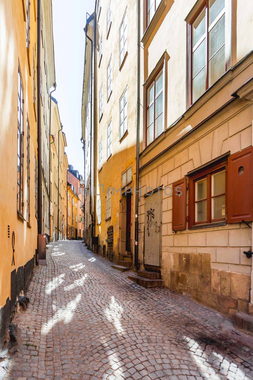 STOCKHOLM, SWEDEN - July 06, 2017. Narrow streets in historic part of town. Old fashioned buildings in Gamla stan. by aksenovko