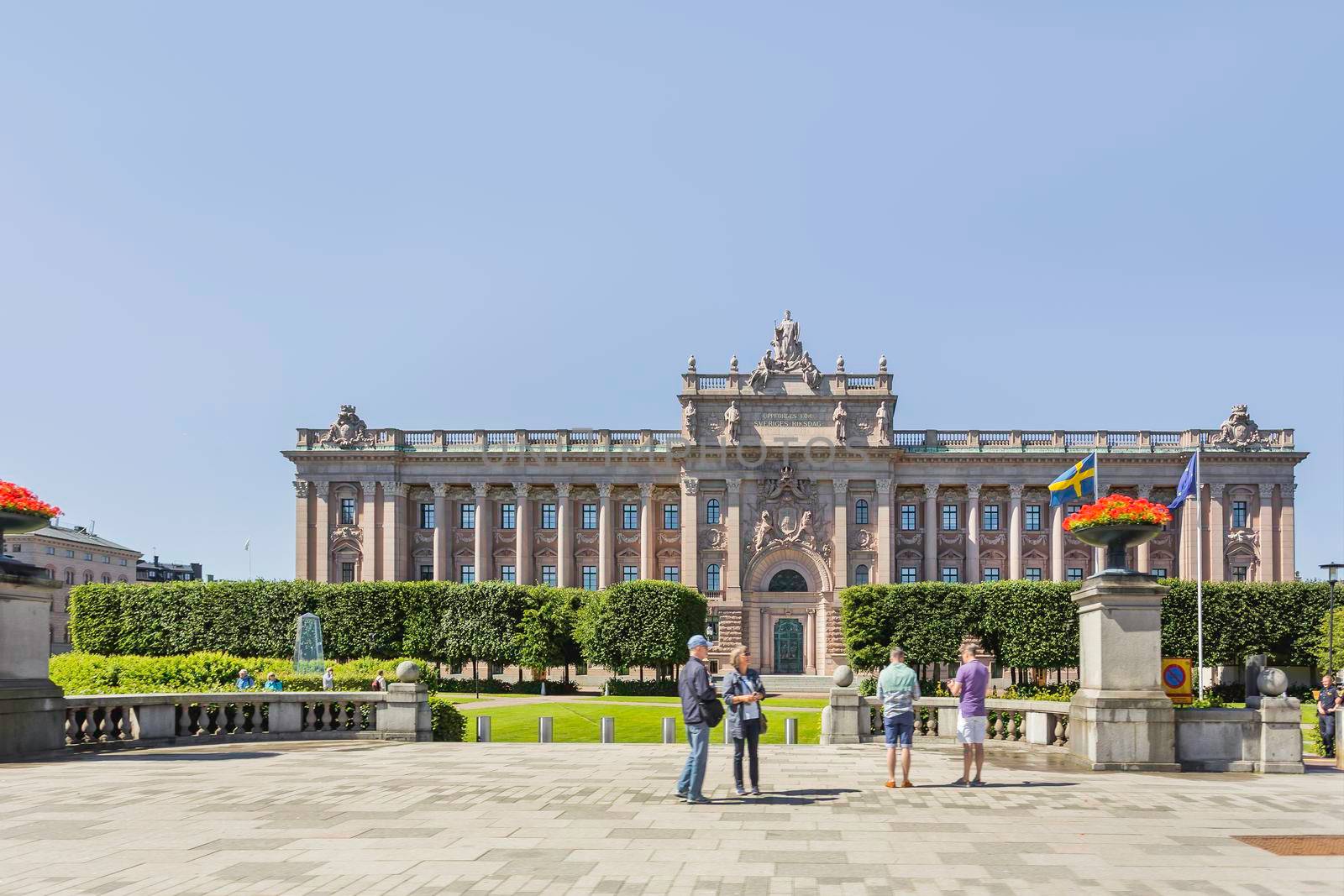 STOCKHOLM, SWEDEN - July 06, 2017. Tourists near Parliament House, seat of parliament of Sweden, the Riksdag.