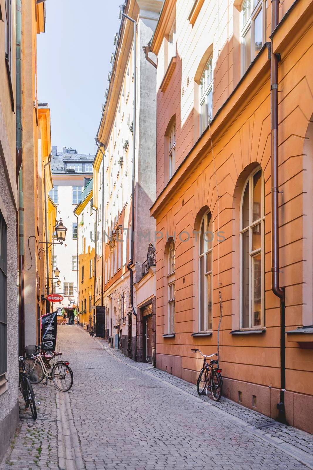 STOCKHOLM, SWEDEN - July 06, 2017. Narrow streets in historic part of town. Old fashioned buildings in Gamla stan.