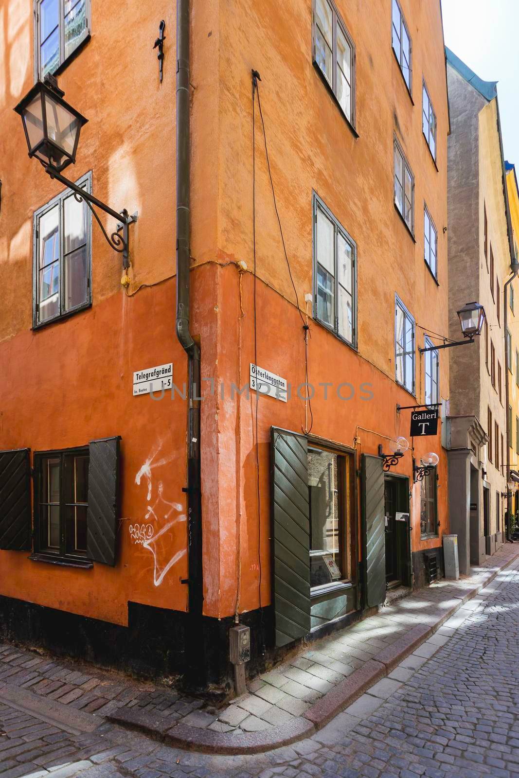 STOCKHOLM, SWEDEN - July 06, 2017. Narrow streets in historic part of town. Old fashioned buildings in Gamla stan.