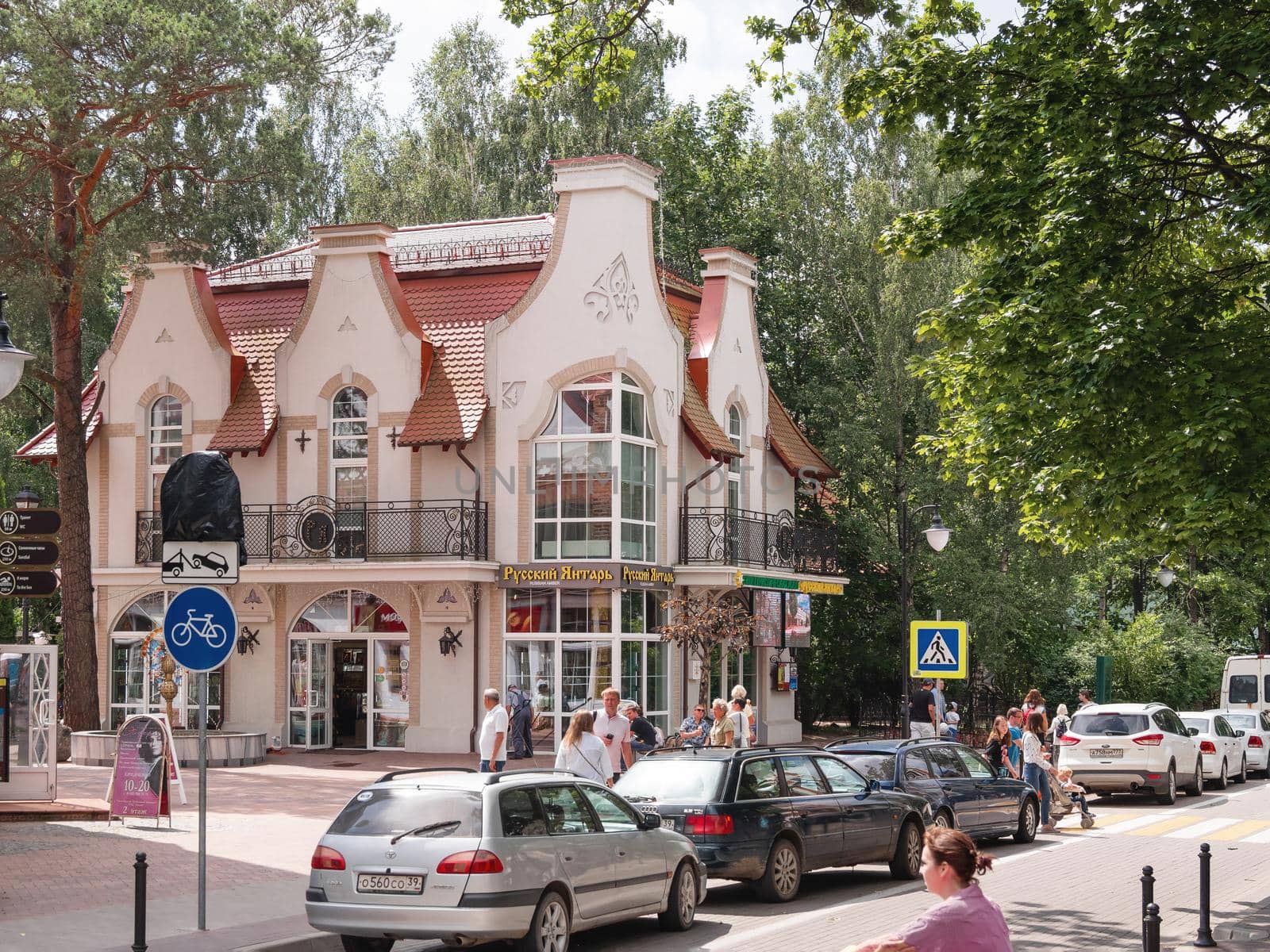 SVETLOGORSK, RUSSIA - July 21, 2019. People walk on Central square of Svetlogorsk, ex-Rauschen. by aksenovko