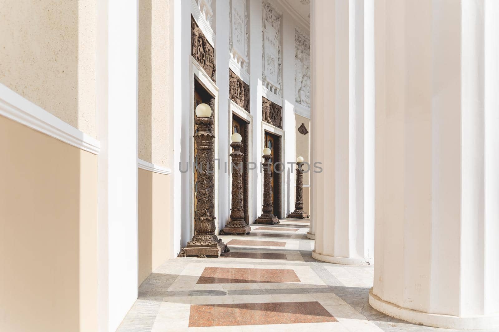 MOSCOW, RUSSIA - May 22, 2015. Architectural ornamental columns and wooden doors of entrance in Main Pavilion. VDNH or Exhibition of Achievements of National Economy.