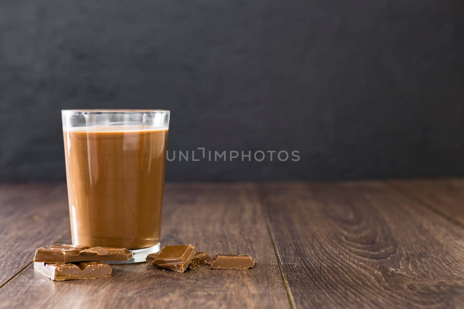 transparent glass chocolate milkshake with copy space