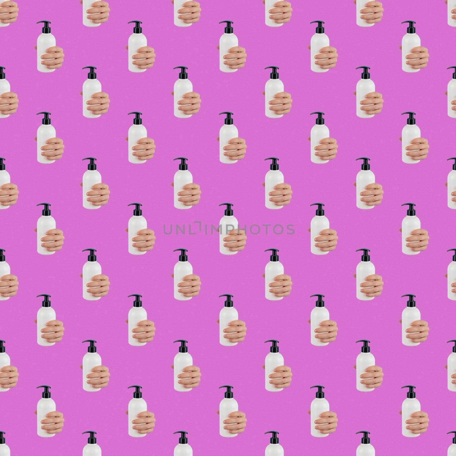 A woman's hand sticks out of a hole in a pink paper background and holds a skin lotion pump. Endless pattern