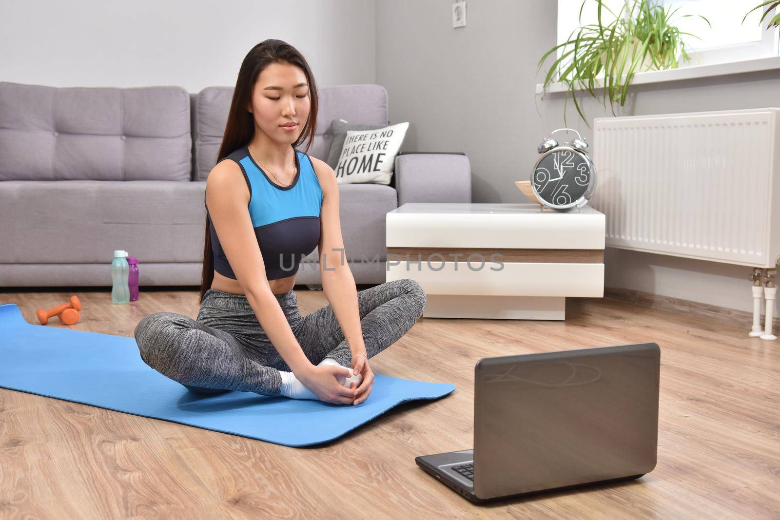 Young asian woman making online training yoga by Bonda