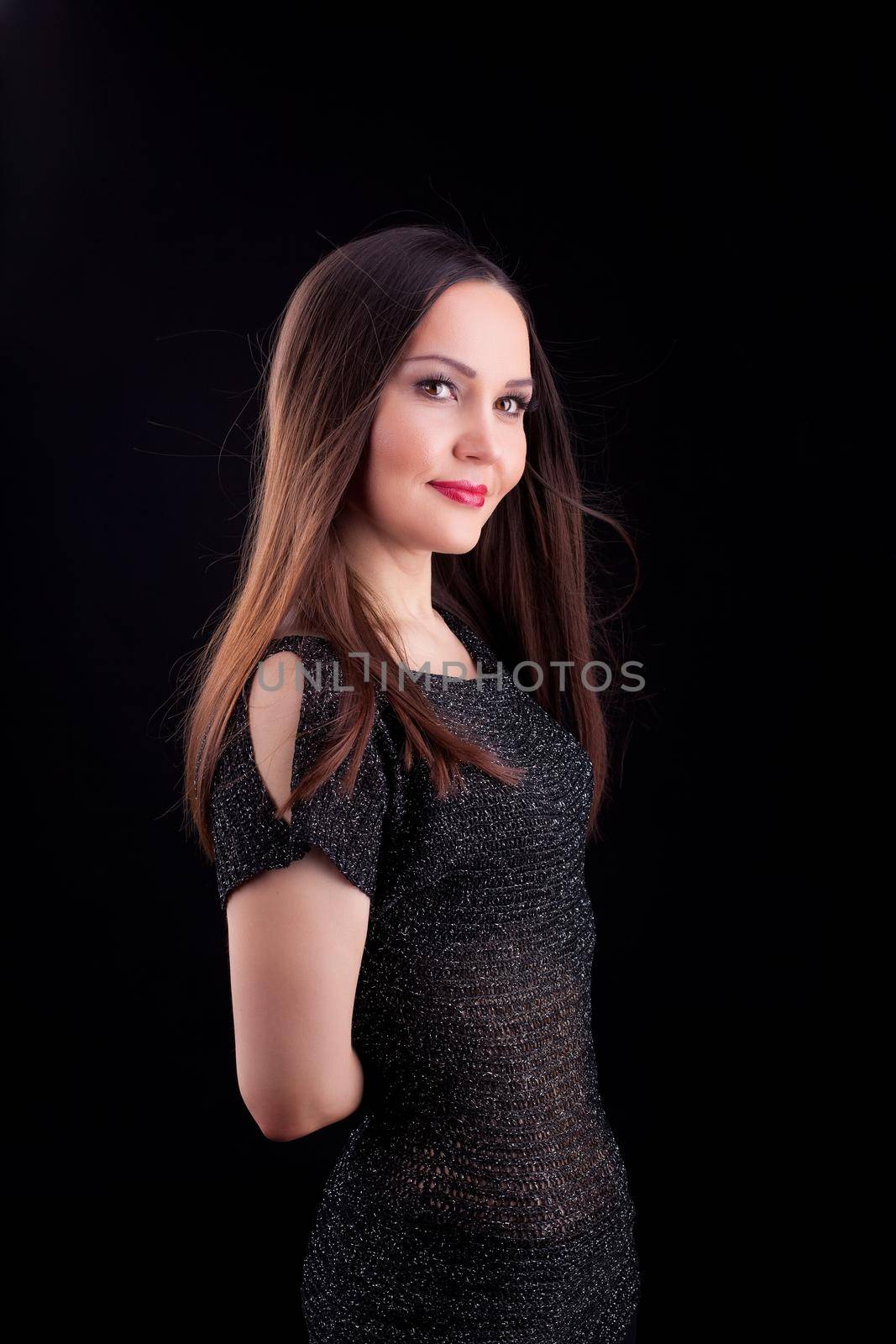 woman with long hair in dark cloth smile