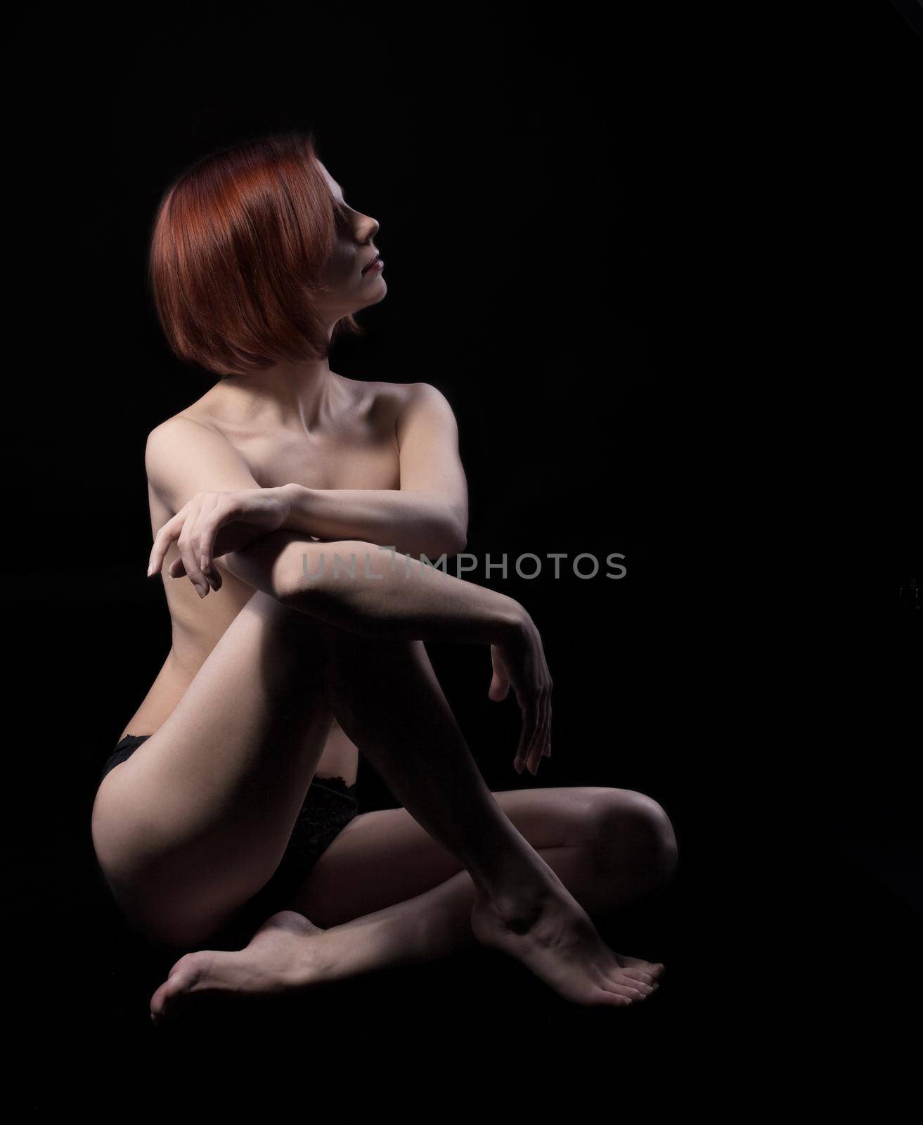 Beauty nude woman sit on black by rivertime