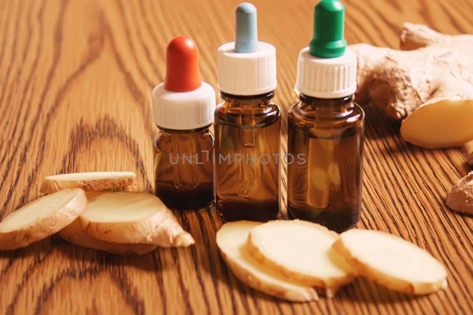 Ginger essential oil in a small bottle. Selective focus.nature