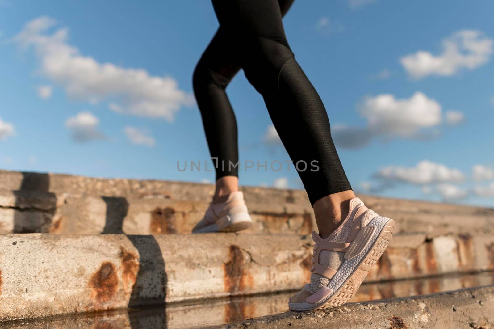 woman jogging stairs close up